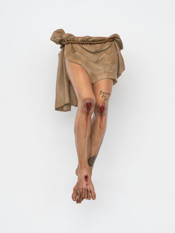 Paul Pfeiffer, Justin Bieber Legs Crucified (Seville), 2026. Cedar wood, paint, and metal armature. 46 1/2 x 20 x 18 inches. Courtesy of the artist and Perrotin.