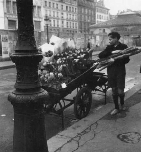 Robert Doisneau, Voiture de Quatre-Saisons: Les Fleurs de la Place du Marche Saint-Honore [Le Gosse aux Baguettes], 1946/Printed Later